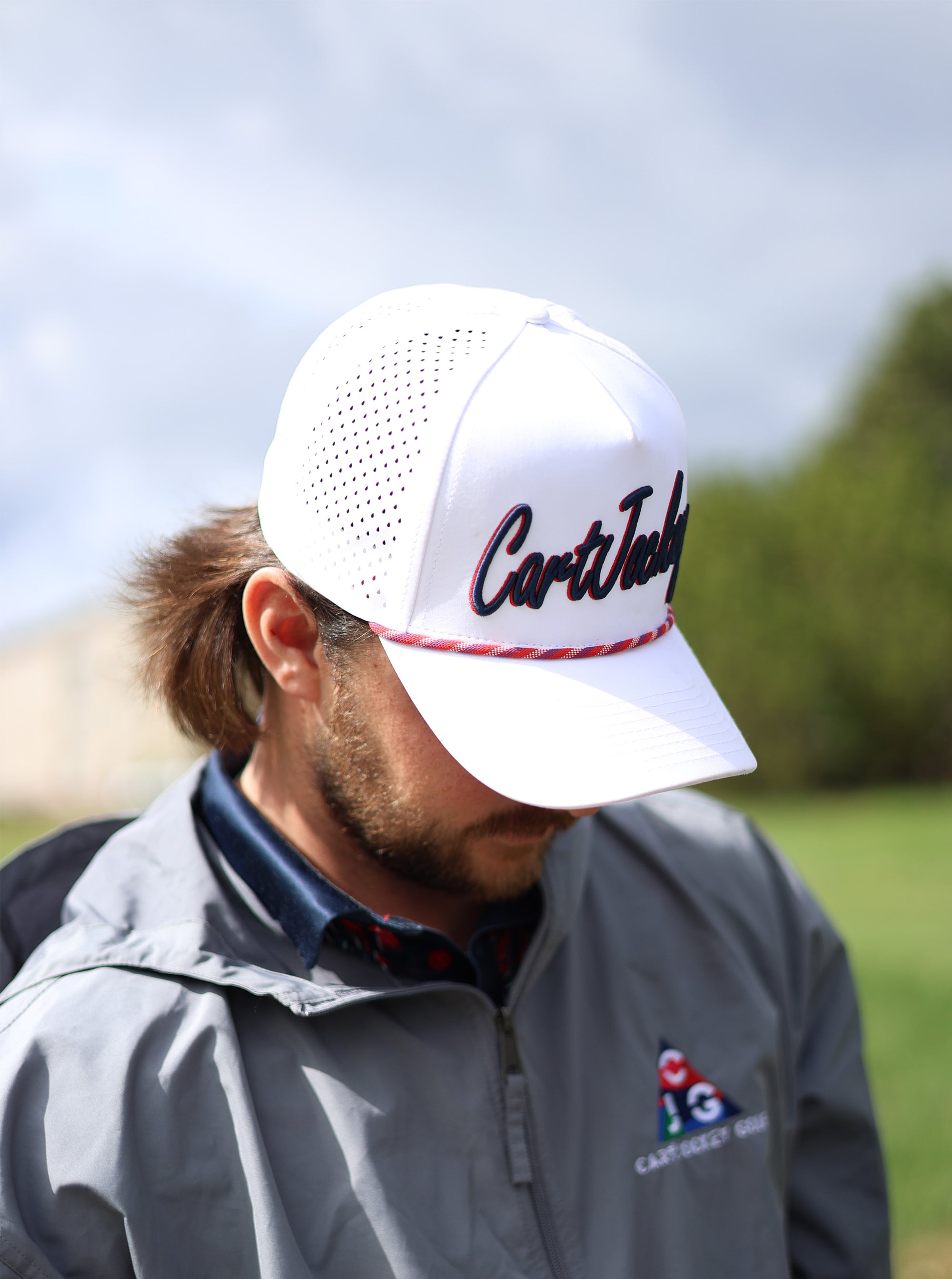 a man is wearing a hat with the word cortland on it.
